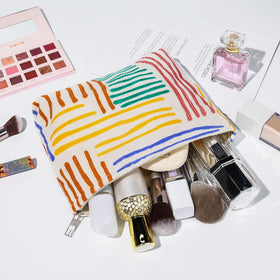 SOIDRAM makeup bag set on a vanity with cosmetics