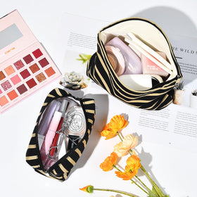 SOIDRAM Makeup Bag set on travel suitcase
