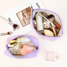 SOIDRAM makeup bags displayed on a travel suitcase