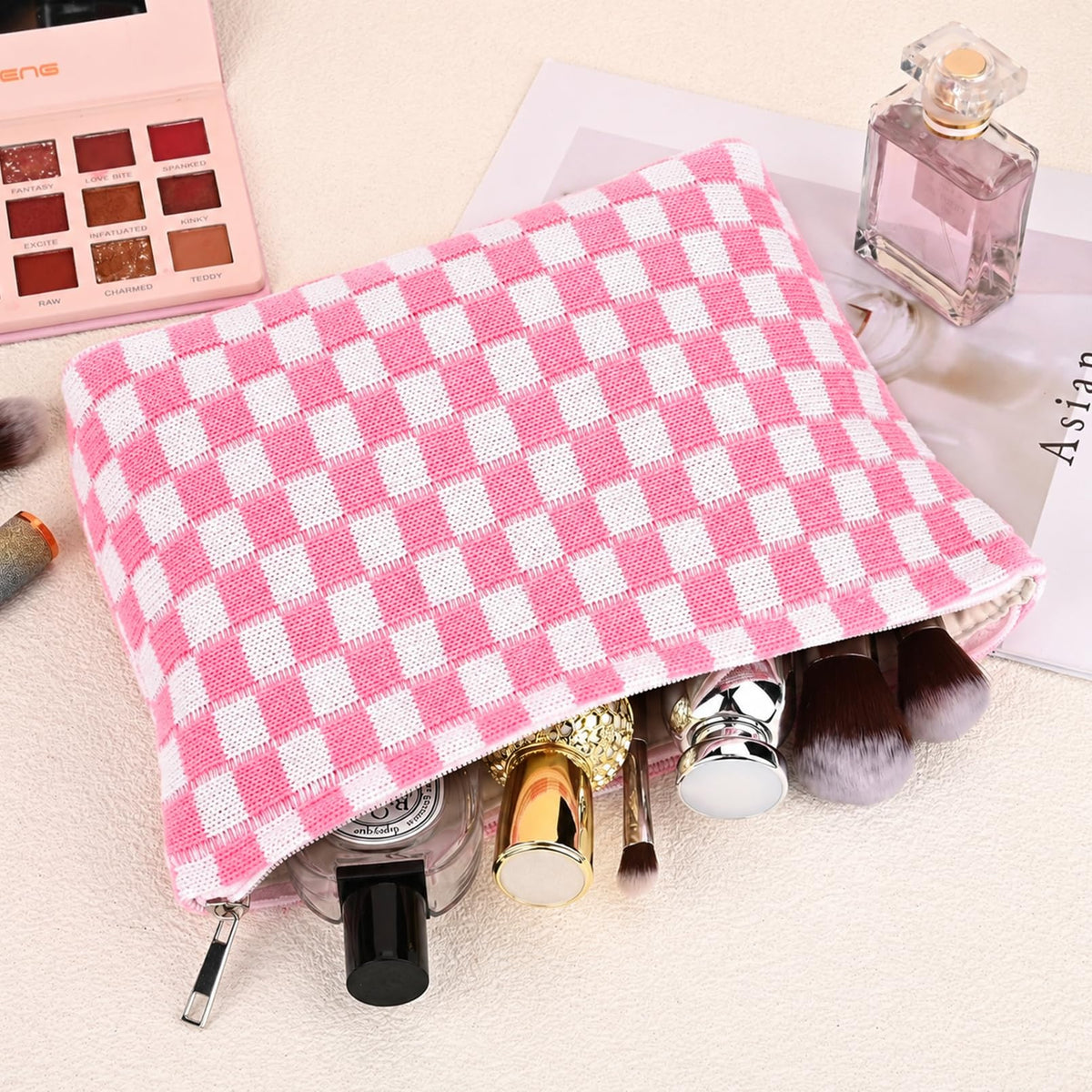 SOIDRAM pink checkered makeup bag in travel setting