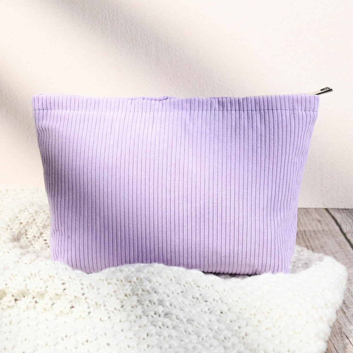SOIDRAM purple cosmetic bags stacked together