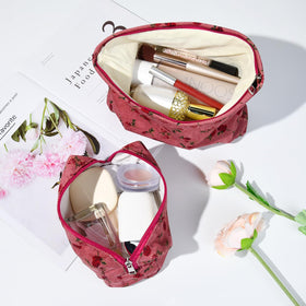 SOIDRAM Rose Makeup Bag in travel setting with cosmetics