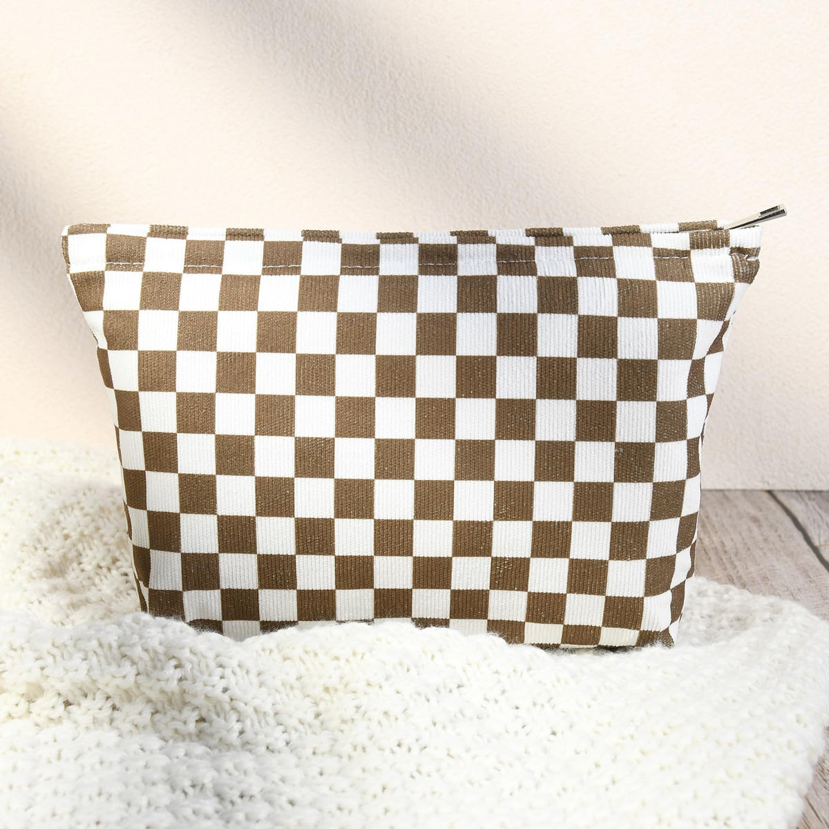 SOIDRAM travel cosmetic bag on a suitcase