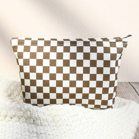 SOIDRAM travel cosmetic bag on a suitcase
