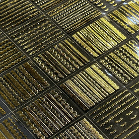 SPLOCUDU gold nail stickers applied on acrylic nails