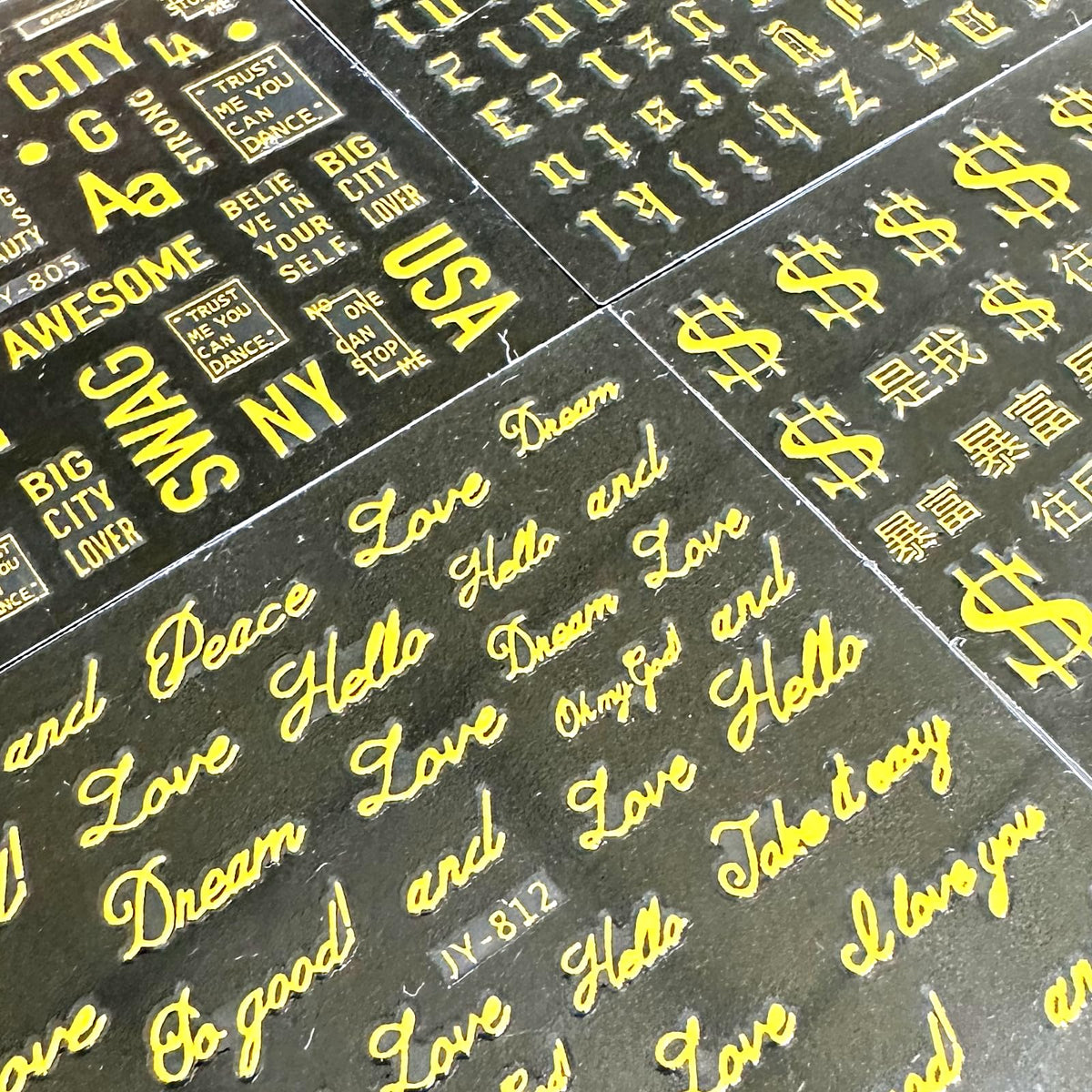 SPLOCUDU gold nail stickers on a decorative nail art display