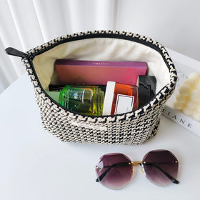 STARDW Checkered Makeup Bag in a travel setting with toiletries