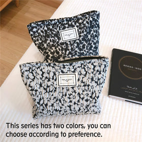 STARDW Floral Makeup Bag on a travel suitcase