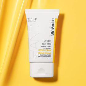 StriVectin Crepe Control® hand cream application on hands