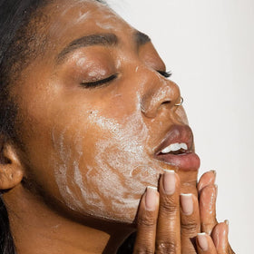 Summer Fridays Super Amino Gel Facial Cleanser in hand for application
