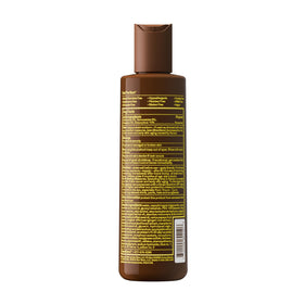 Sun Bum SPF 15 Browning Body Lotion in a lifestyle setting on the beach