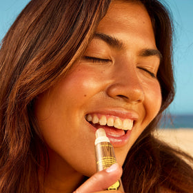 Sun Bum SPF 30 Coconut Lip Balm stick showing texture