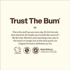 Sun Bum sunscreen products on a beach towel