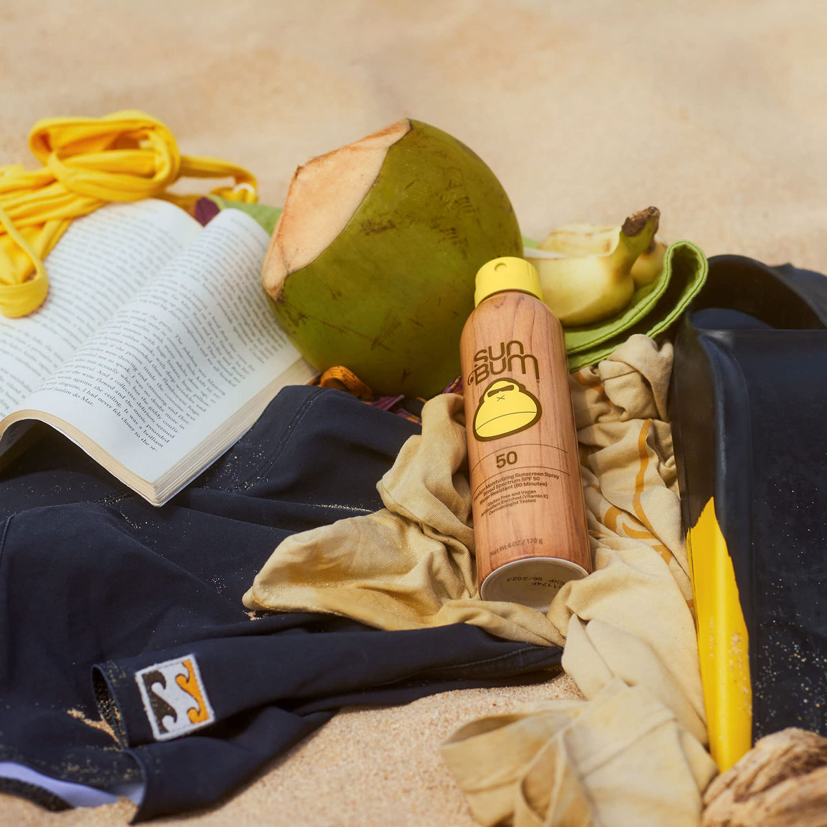 Sun Bum sunscreen spray being applied on skin