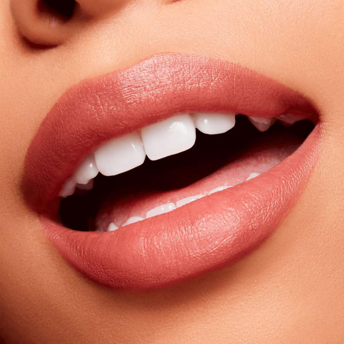 Swatch of MAC Powder Kiss Velvet Blur Slim Stick Over the Taupe on skin