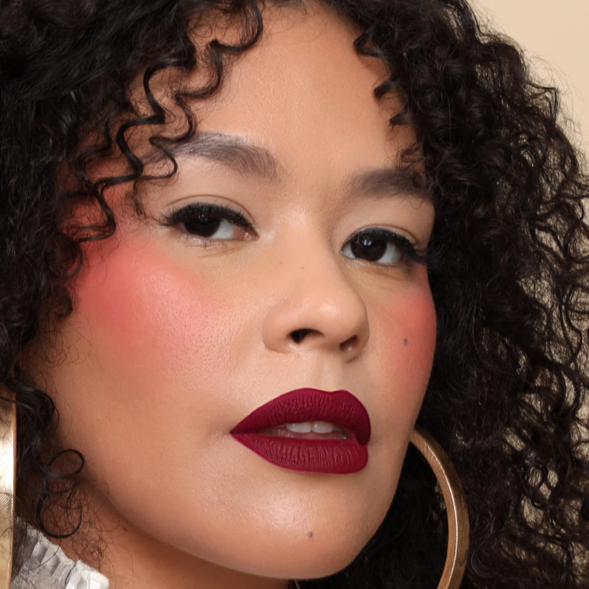 Swatches of Playmate, Brickhouse, and Muse on skin