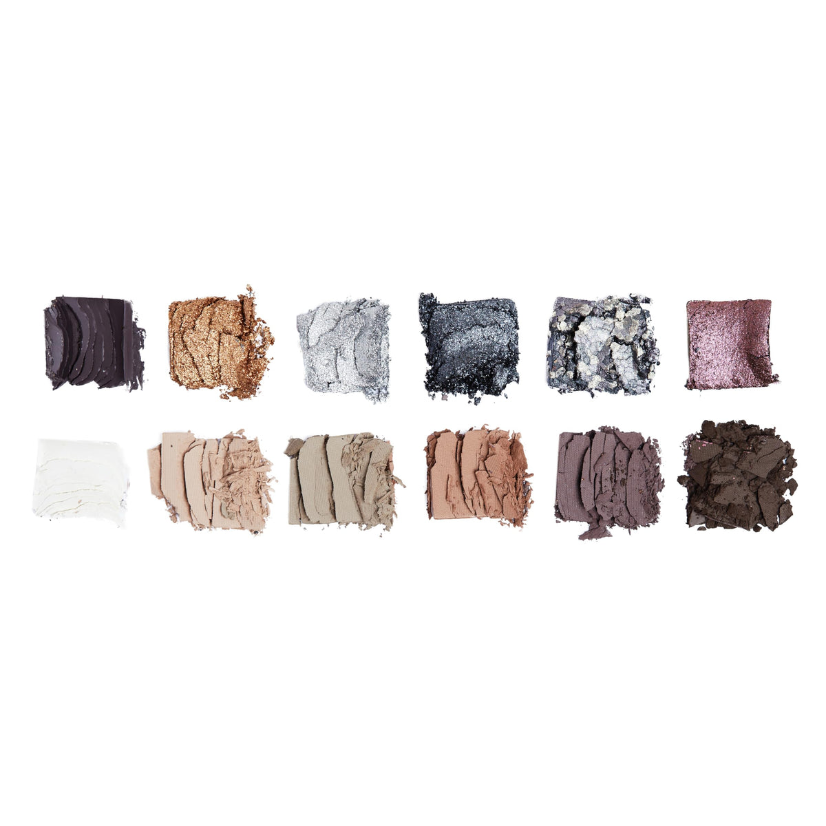 Swatches of Revolution Smokey Icon Palette shades on skin