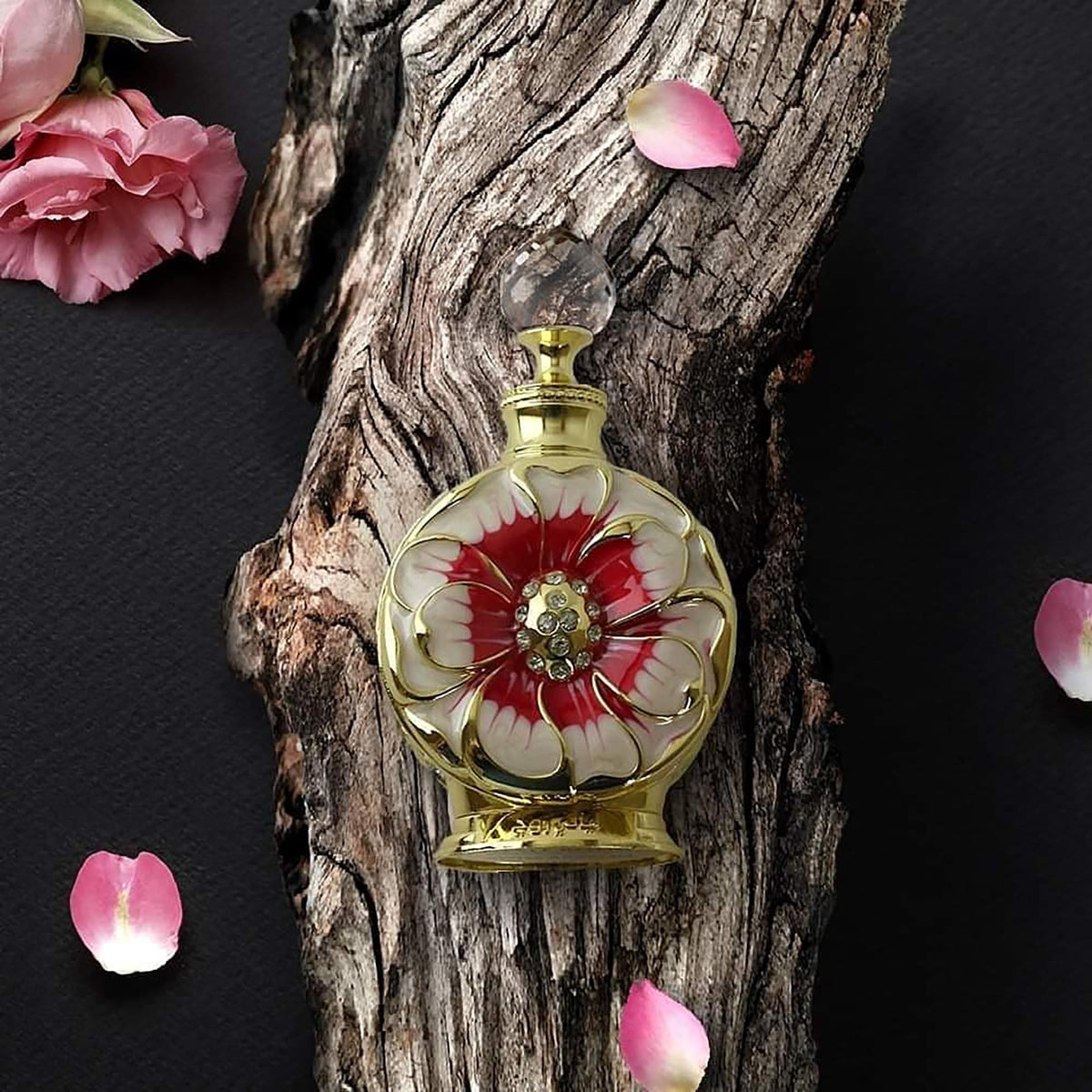 Swiss Arabian Layali Rouge perfume oil with floral background