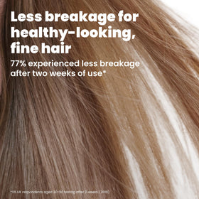 TANGLE TEEZER Fine Ultimate Detangler Brush in hand with hair product