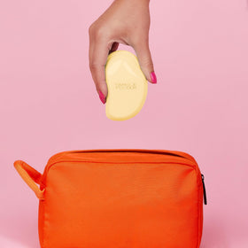 TANGLE TEEZER Mini Detangler Hair Brush displaying its flexible teeth