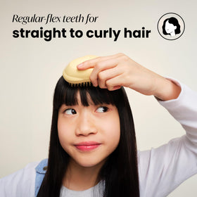 TANGLE TEEZER Mini Detangler Hair Brush on a bathroom counter