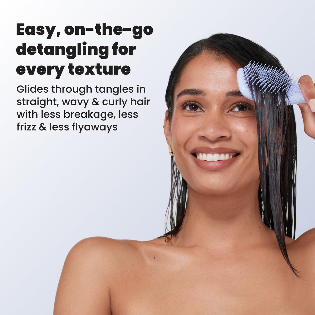 TANGLE TEEZER Mini Hair Brush Digital Lavender in use on wet hair