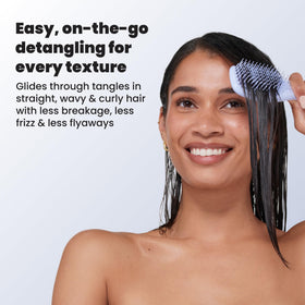 TANGLE TEEZER Mini Hair Brush Digital Lavender in use on wet hair