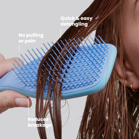 TANGLE TEEZER Ultimate Detangler Brush in lifestyle setting on bathroom counter