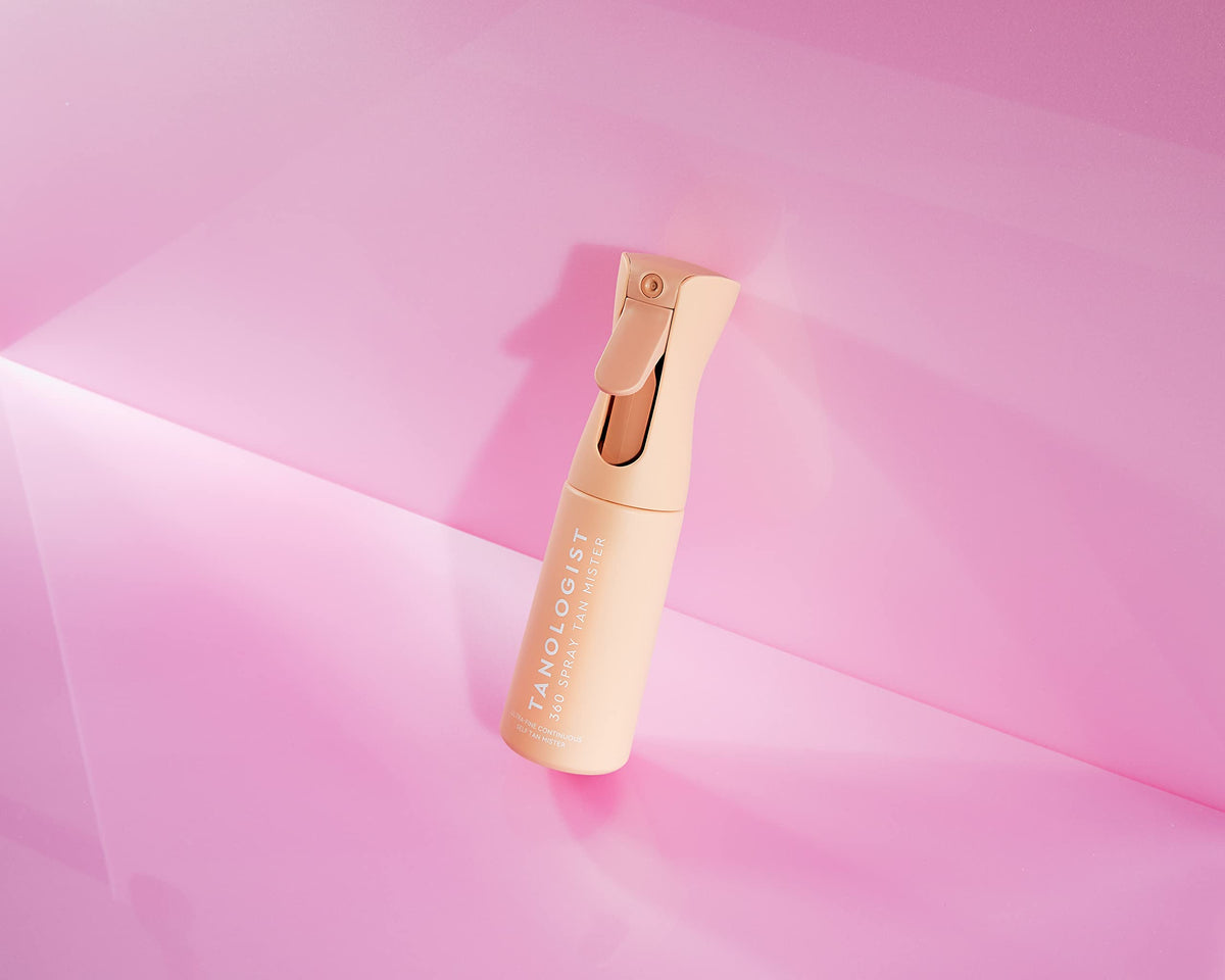 Tanologist 360 Spray Tan Mister in use with tanning water