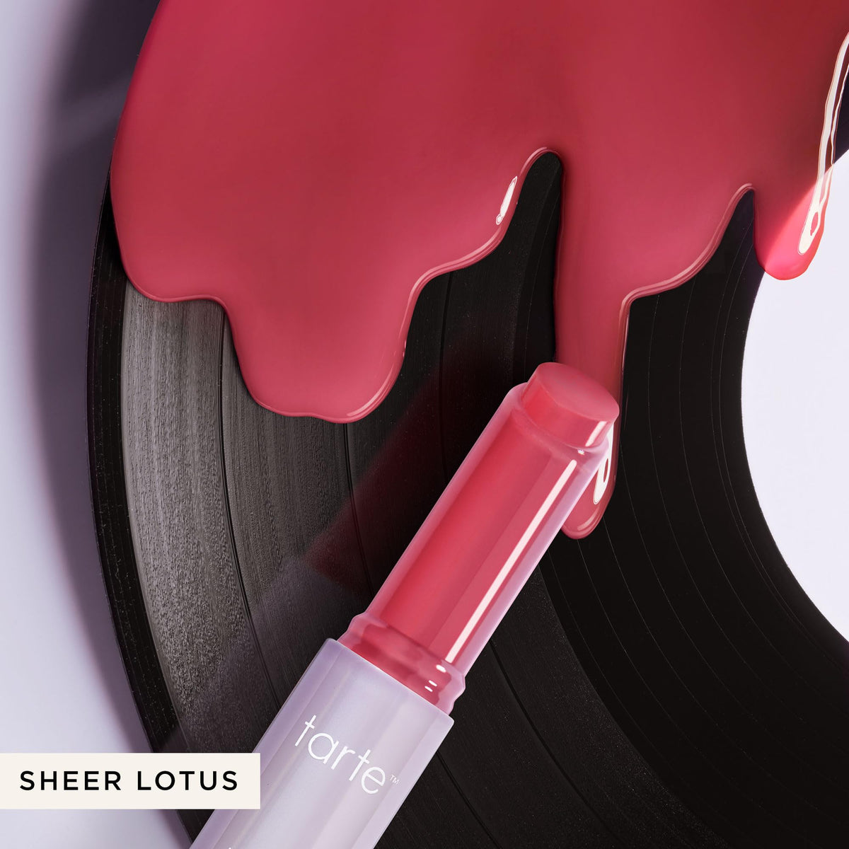 tarte Maracuja Juicy Lip Vinyl Gloss displayed with beauty accessories