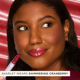 tarte Maracuja Juicy Lip Vinyl Gloss shimmering cranberry applicator close-up