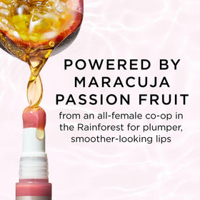 tarte Maracuja Juicy Plumping Lip Oil in hand for size reference