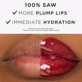 tarte Maracuja Juicy Plumping Lip Oil on a marble surface