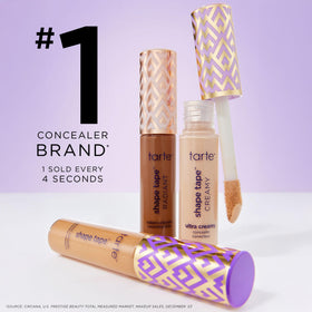 tarte Shape Tape Concealer and Maracuja Juicy Lip Duo set displayed with makeup accessories