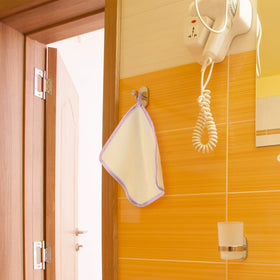 Tatuo Exfoliating Bath Cloths laid out on a towel
