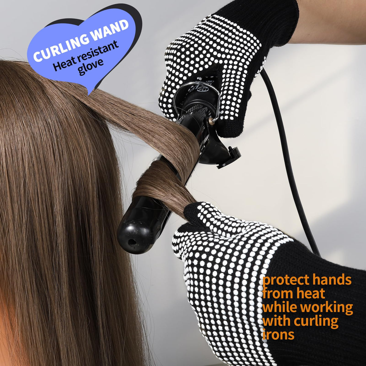 Teenitor heat resistant gloves on a table with hair styling tools