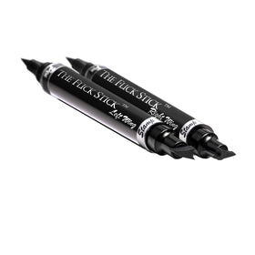 The Flick Stick Eyeliner Stamp Midnight Black with other makeup tools