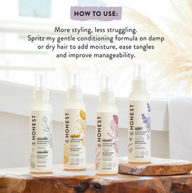 The Honest Company Hair Detangler in use on hair