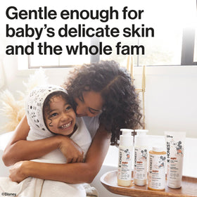 The Honest Company Sweet Cream Conditioner with a child's hairbrush
