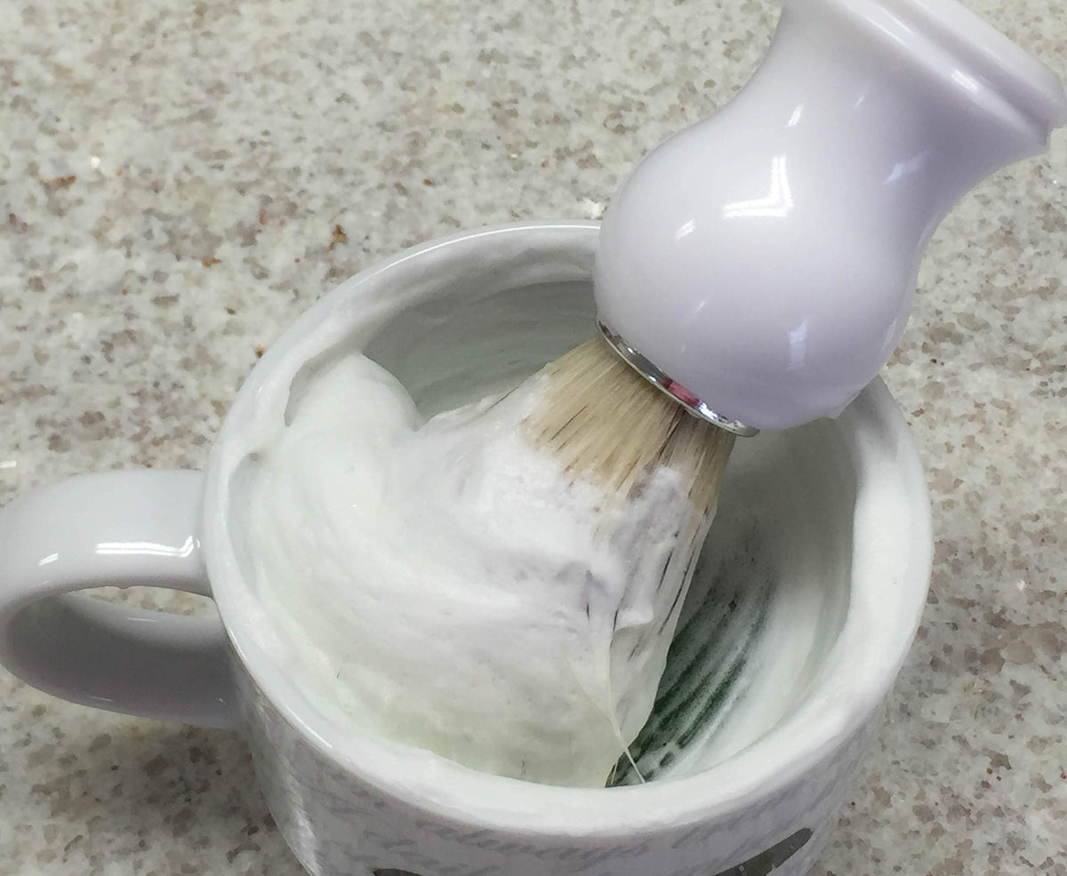 The Village Soapsmith Shaving Soap in use with shaving brush