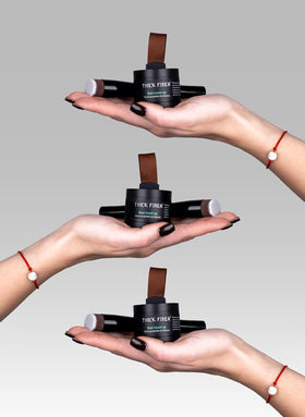 Thick Fiber Root Touch Up Powder Set Light Brown on a vanity