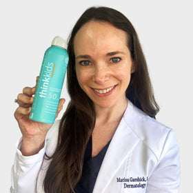 THINK Kids Sunscreen Spray SPF 50+ packaging with ingredients