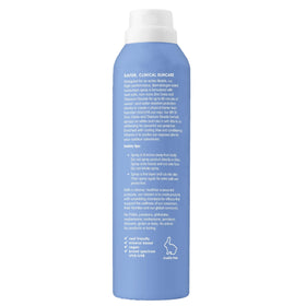 Thinksport Mineral Sunscreen Spray SPF 50+ packaging on a picnic table