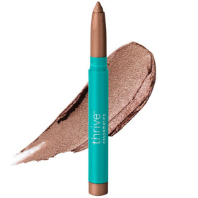Thrive Causemetics Brilliant Eye Brightener Stick front view in Cool Gold Shimmer