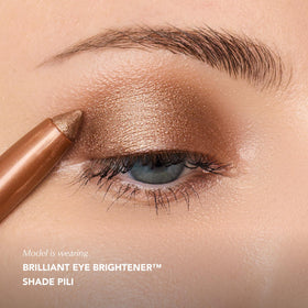 Thrive Causemetics Brilliant Eye Brightener Stick in a beauty routine setup