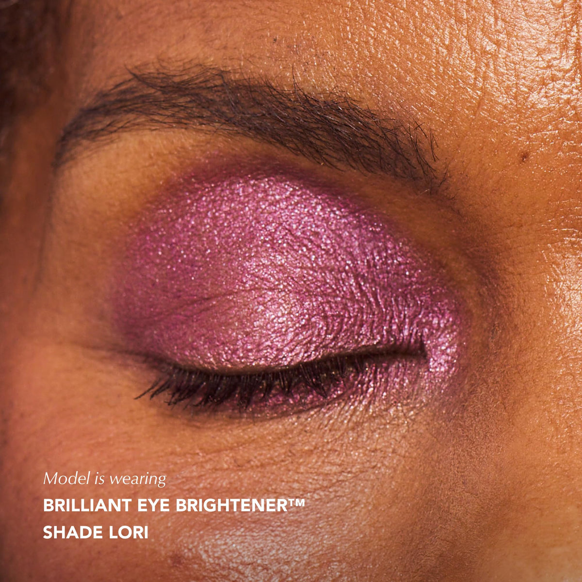 Thrive Causemetics Brilliant Eye Brightener Stick Plum Shimmer in use during makeup application