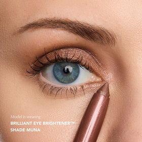 Thrive Causemetics Eye Brightener Stick in a beauty setup