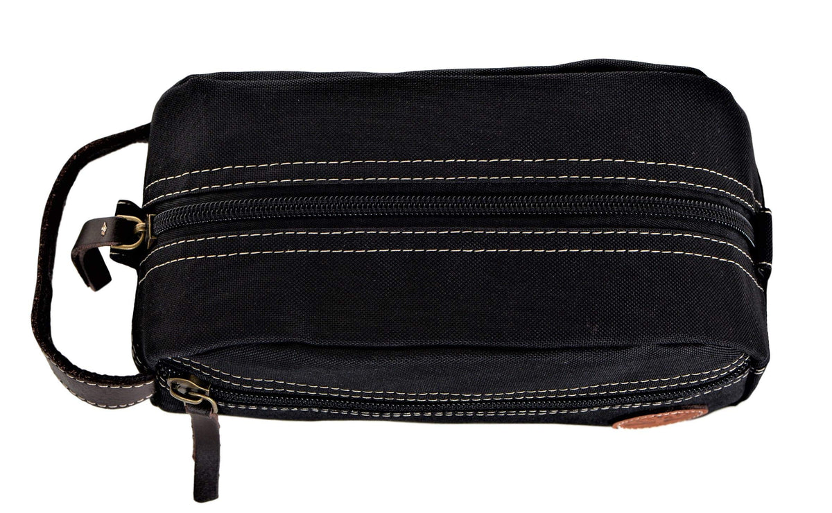 Timberland Men's Toiletry Bag on a travel counter with toiletries
