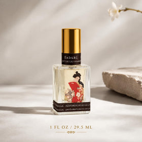 TOKYOMILK Kabuki Eau de Parfum on a vanity with flowers