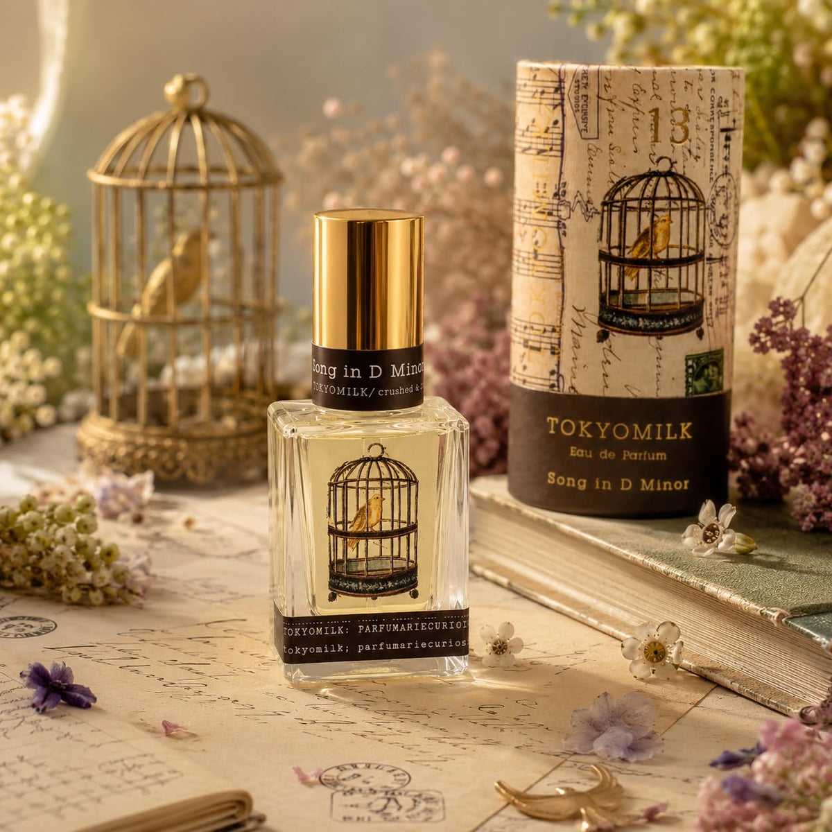 TOKYOMILK Song in D Minor Eau de Parfum displaying bird in cage design